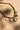Lena Gold & Multi Stone Charm Necklace- close up view