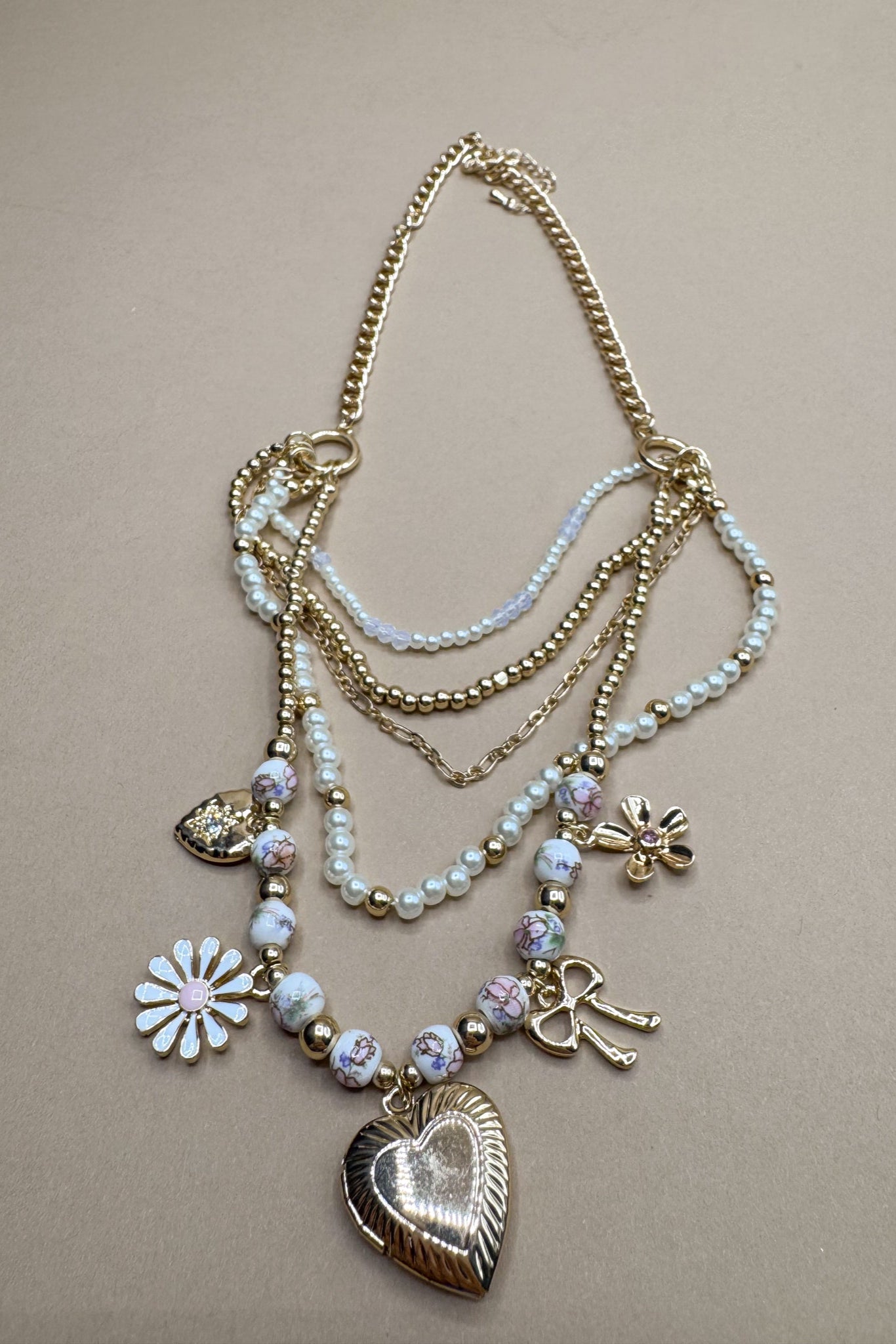 Sophia Pink Multi Charm Layered Necklace- close up view