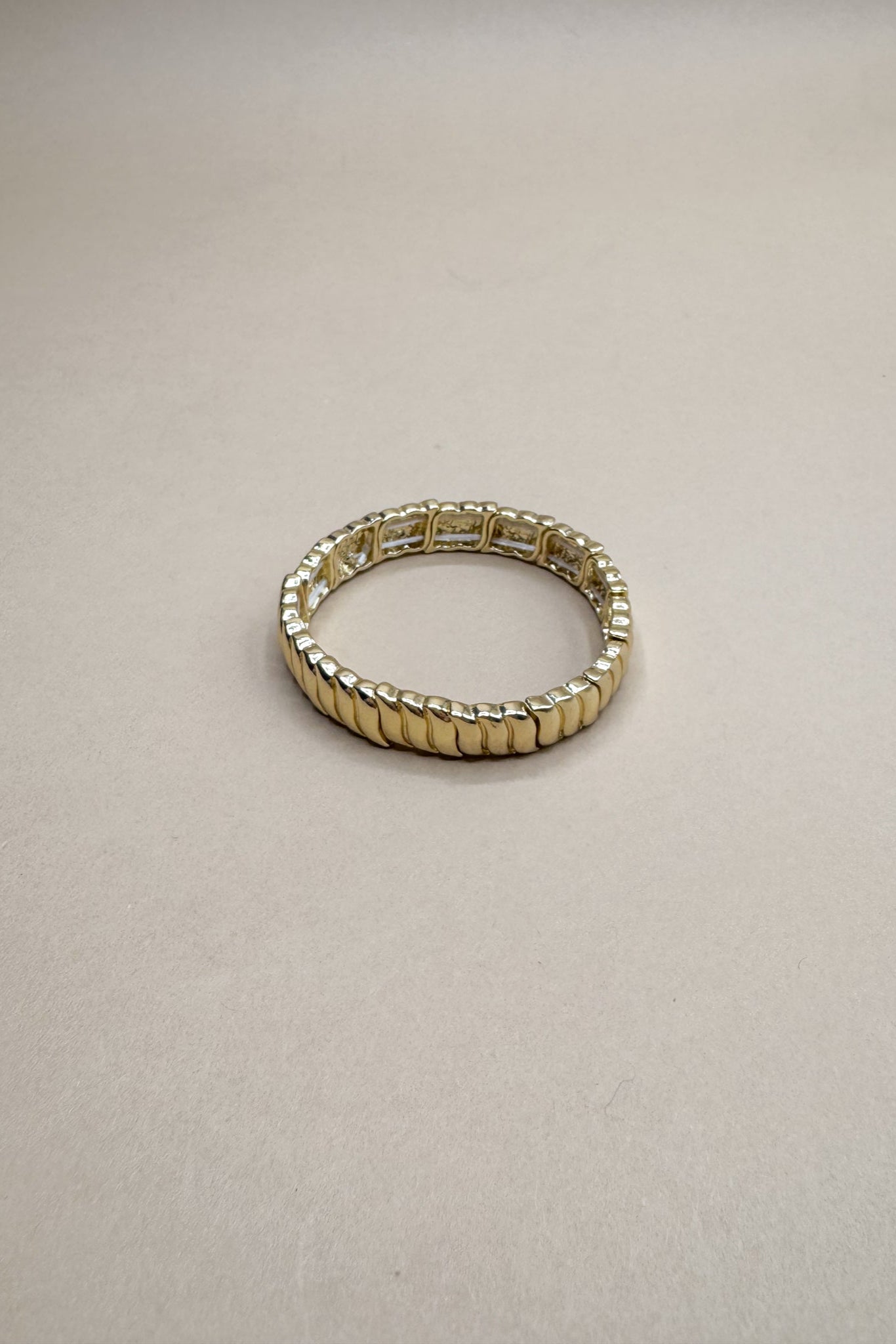 Eliza Gold Ribbed Wave Stretchy Bracelet- flat lay view