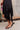 Hallie Black Satin & Lace Asymmetric Dress -close up of hemline 