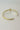She Is Clothed With Strength And Dignity Bangle - gold - close back view flat lay
