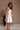 Sadie White Flare Mini Dress- frontal side view