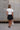 Gabby Black Polka Dot Tiered Mini Skirt - full body back view