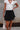 Gabby Black Polka Dot Tiered Mini Skirt - close up front view