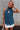 model wearing teal top