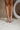 image shows front view of model's legs; model is wearing the Adina Metallic Heels in Silver