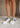 Image shows front view of model's legs; model is wearing the That's Her Platform Sneakers.