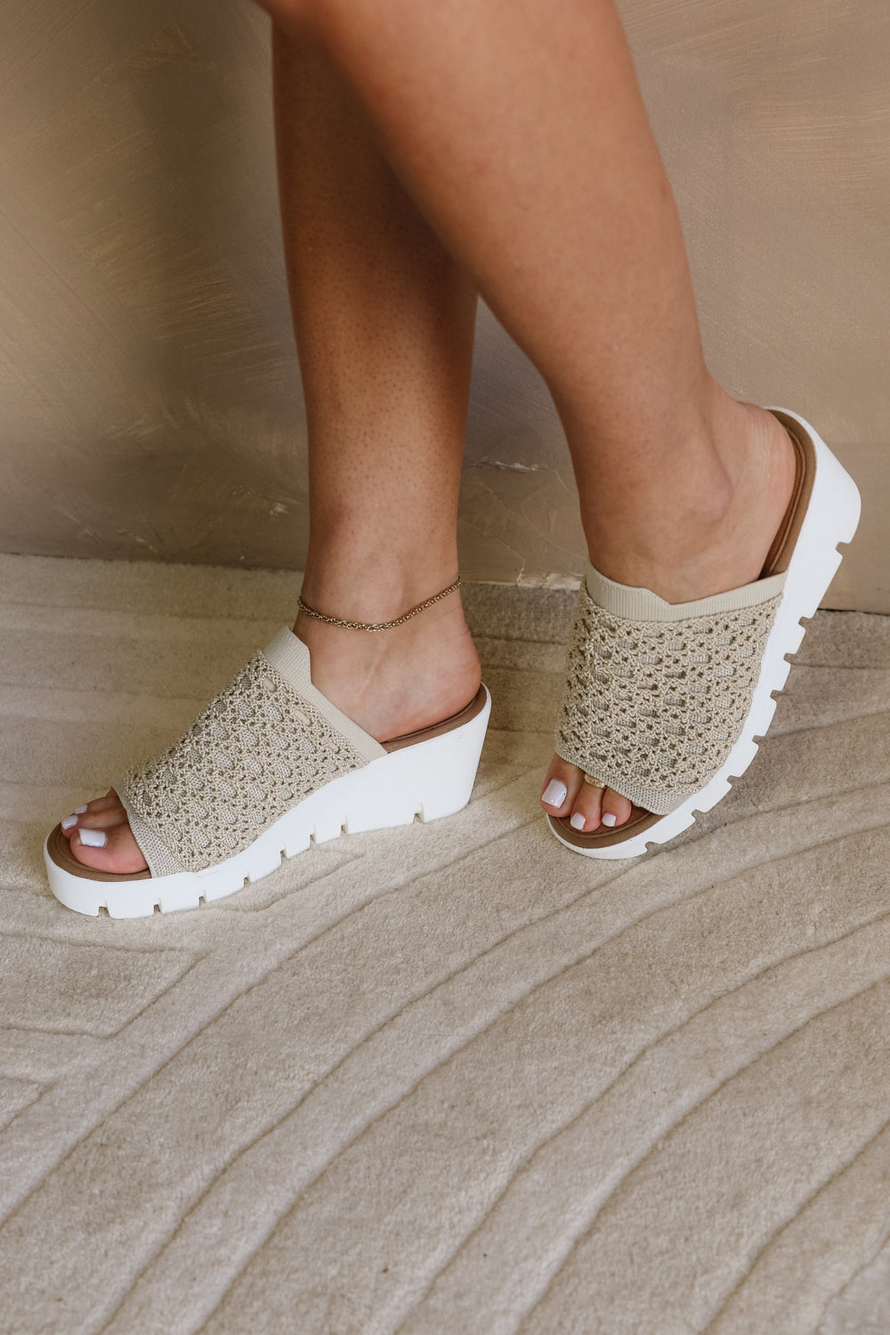 Side view of model wearing the Venti Crochet Sandal in Nude Silver which features Crochet Fabric Upper, Slide On Style, Memory Foam Footbed, 2.25 Inch Platform Wedge and Flexible Rubber Outsole