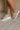 Side view of model wearing the Venti Crochet Sandal in Nude Silver which features Crochet Fabric Upper, Slide On Style, Memory Foam Footbed, 2.25 Inch Platform Wedge and Flexible Rubber Outsole