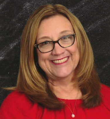 image of a woman in a red top and glasses