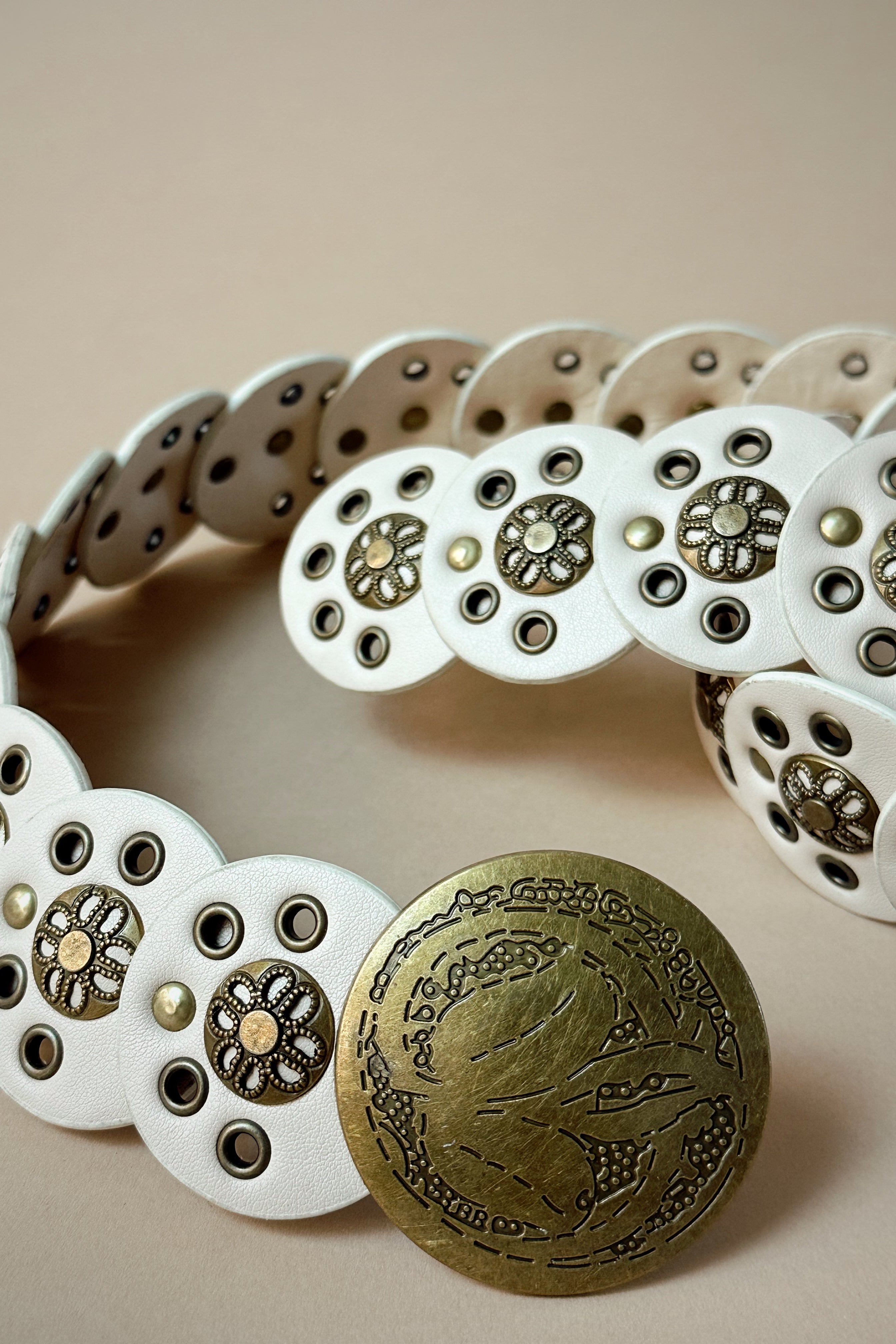 Ada Ivory & Gold Circle Medallion Adjustable Belt- close up view