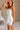 Romy White Strapless Ruffle Mini Dress - close up side view