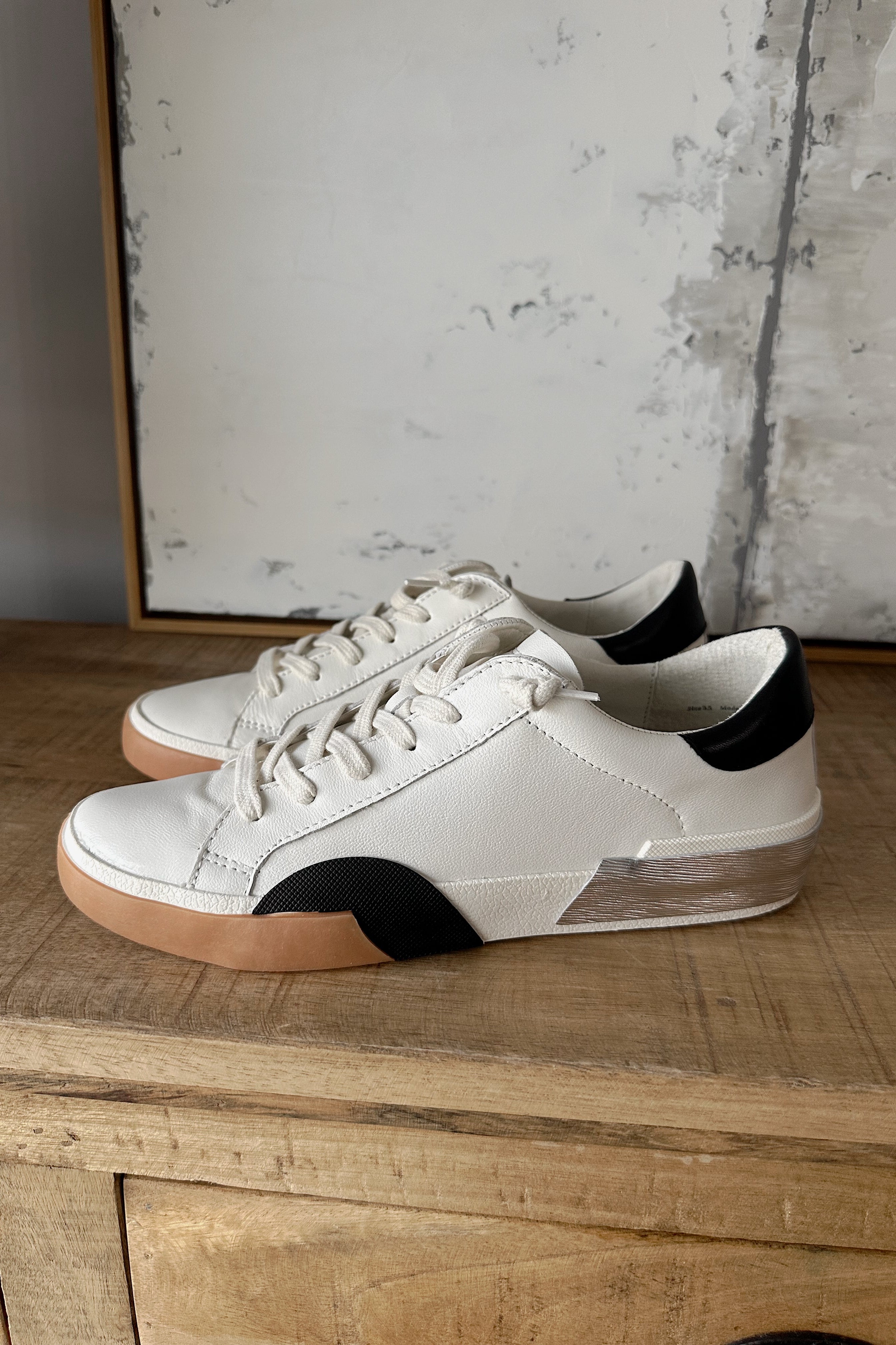 Dolce Vita Zina Sneaker in White Black Leather- left side angle view