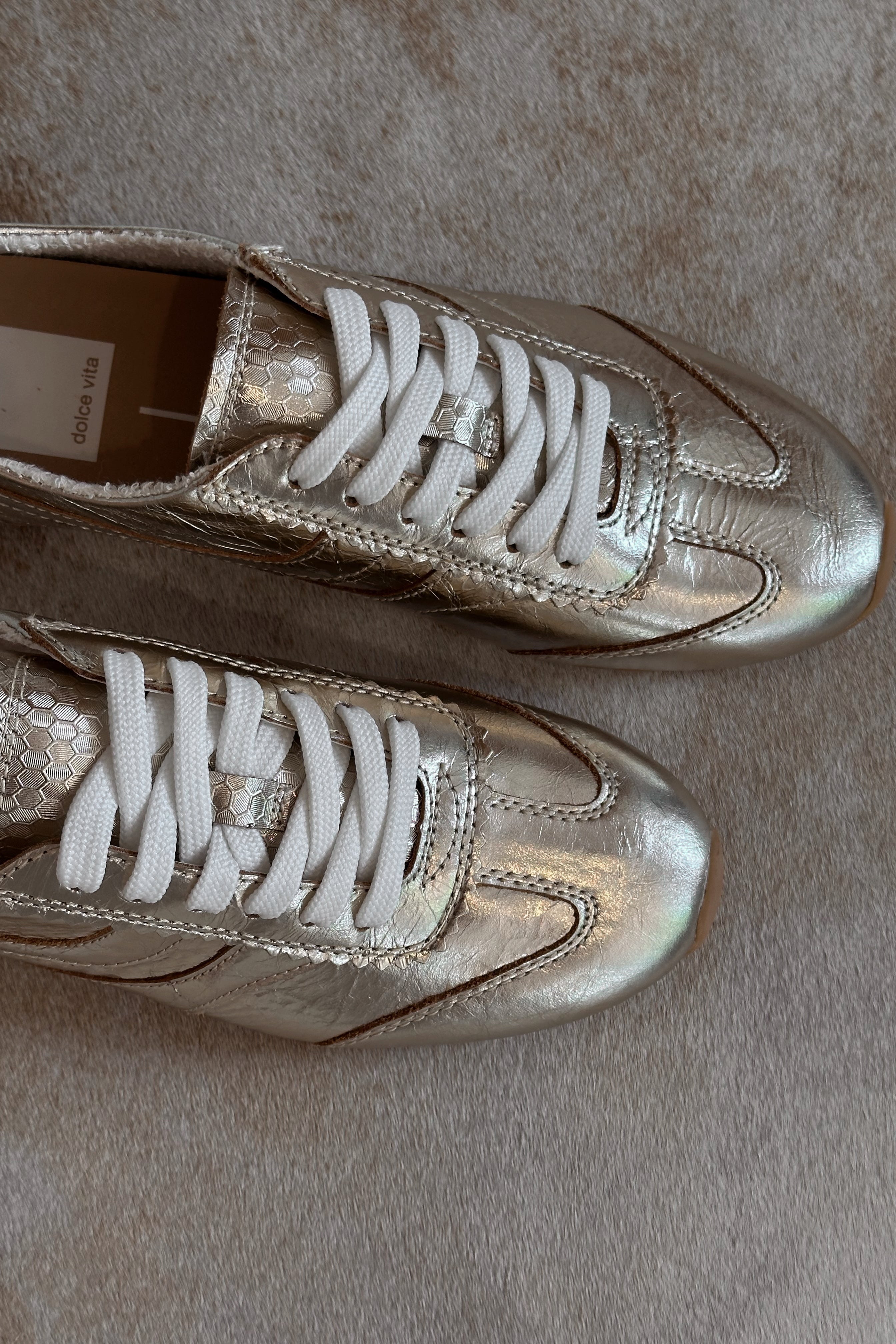 Dolce Vita Delany Light Gold Crinkle Patent Sneaker- top close up view