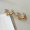 Justine Gold Twist Hoop Earrings - flat lay close up