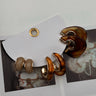 Janine Brown Tortoise Hoop Earring Set - flat lay close up