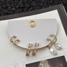 Clara Gold & Pearl Earring Set - flat lay close up