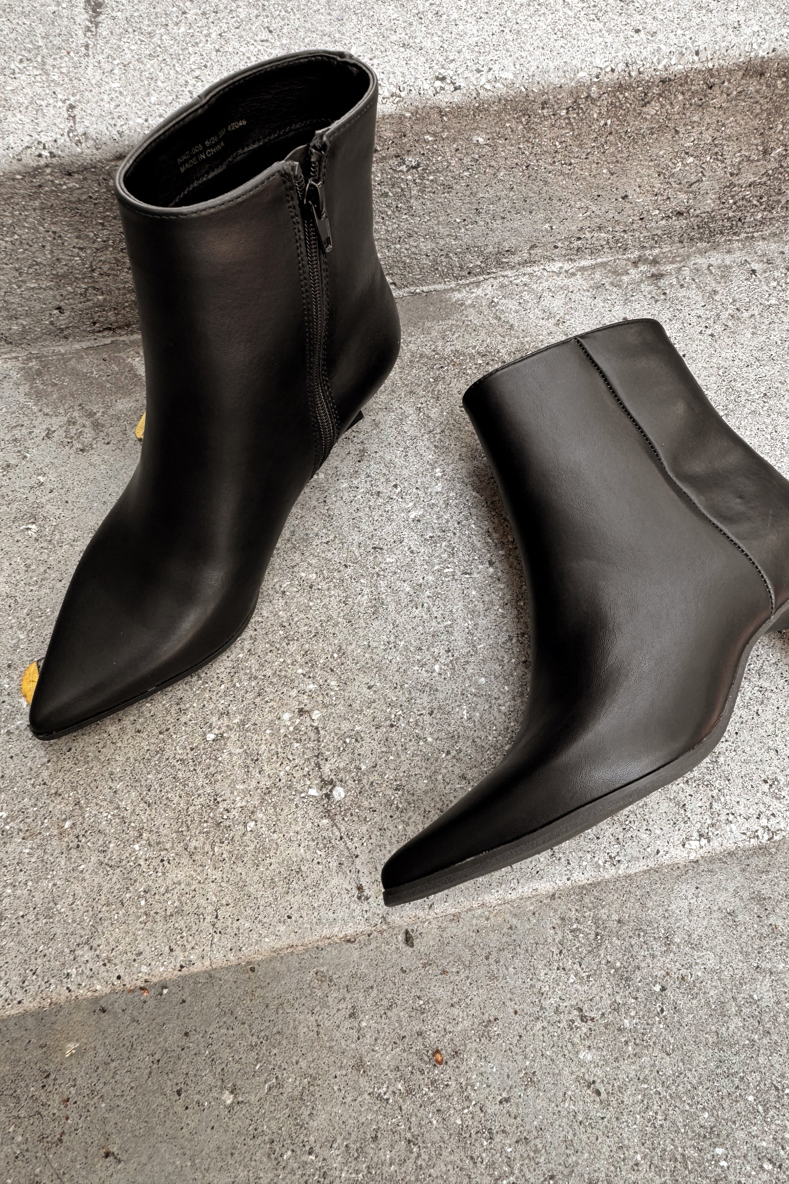 Chinese Laundry Novalie Black Bootie- close up flat lay view