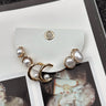 Heather Gold & Pearl Earring Set - flat lay close up