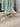 Angie Nude Patent Leather Slide-On Heel - side view on model