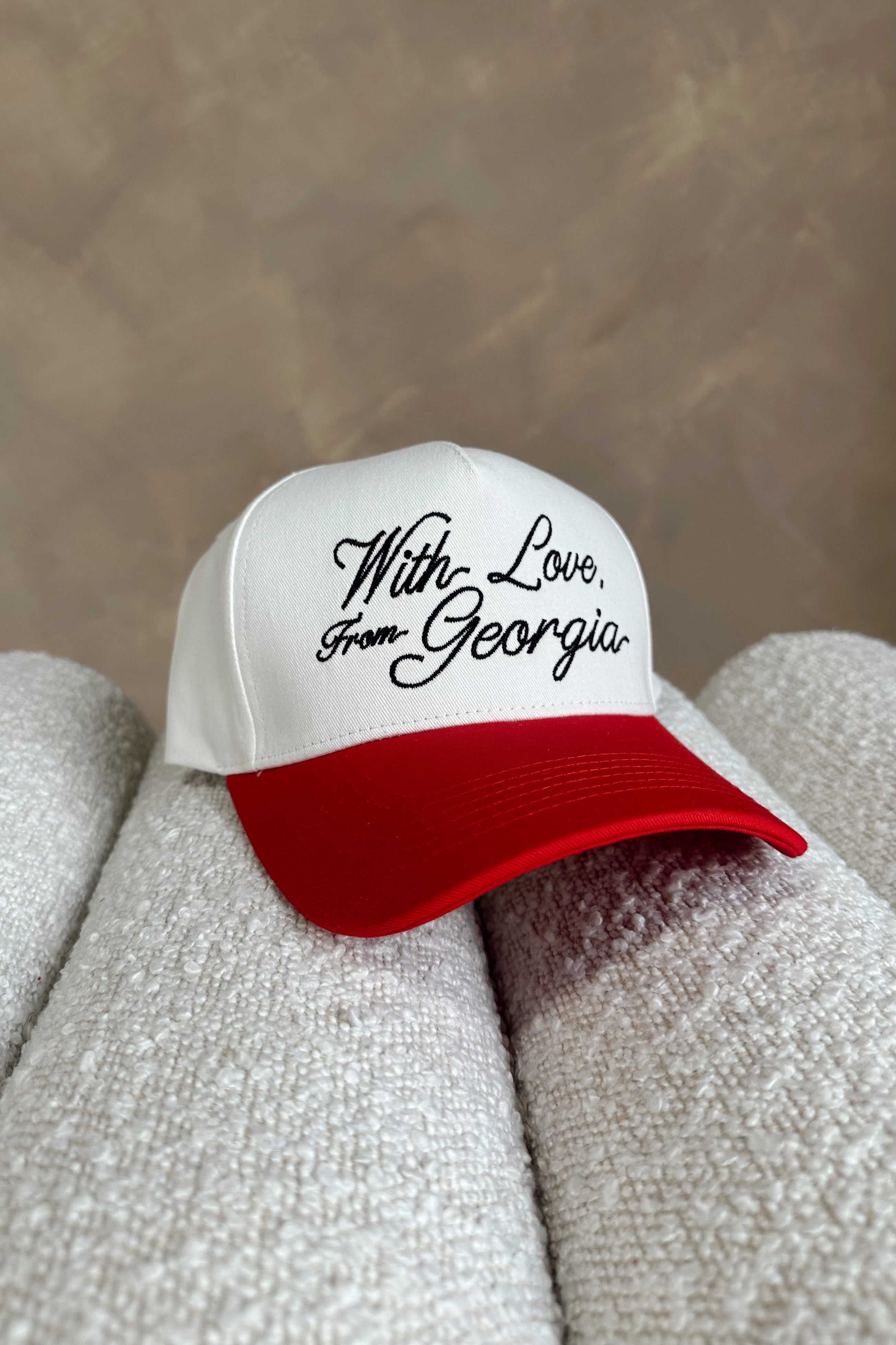 front view of the With Love From Georgia Trucker Hat