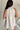 Celeste Natural Linen & Pearls Mini Dress- close up back view