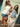 model wearing white tank & denim skirt and other model wearing denim top and polka dot skirt