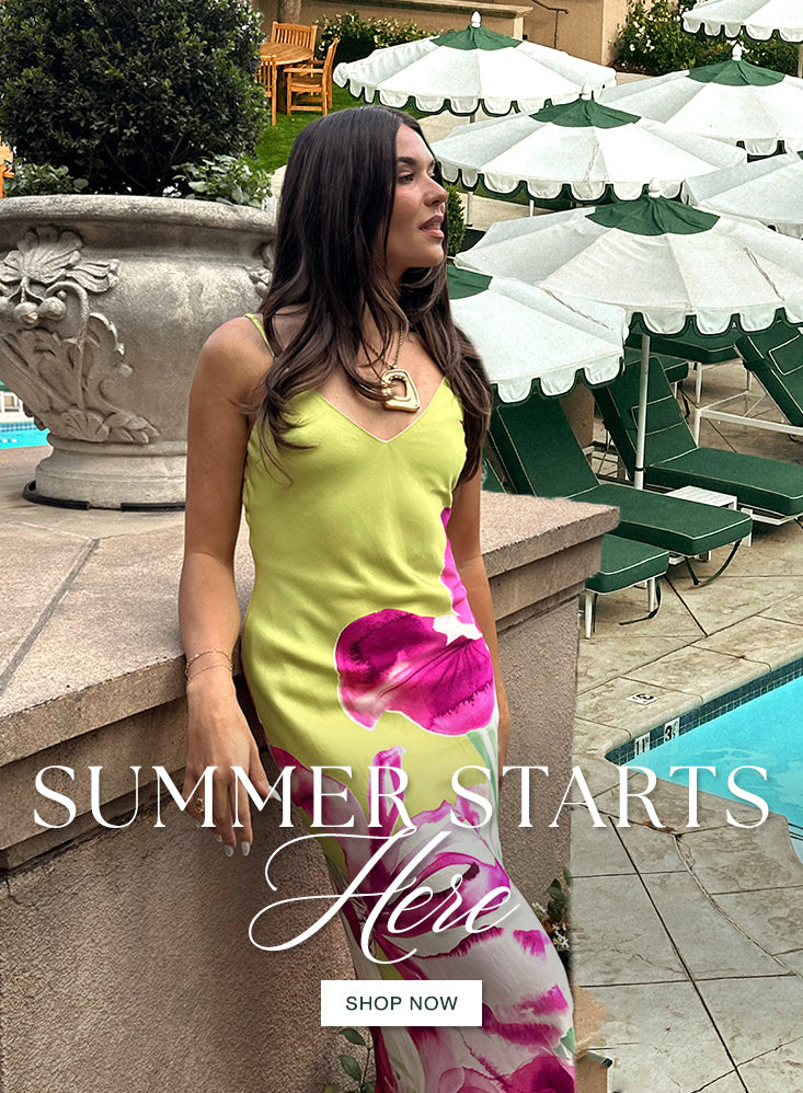 image of model in green and pink floral dress