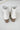 Back view of the Untie Ankle Boot that features a white PU material, a traditional western boot silhouette, a shortened shaft, western inspired embroidery, a zipper closure, and a stacked 2" heel.