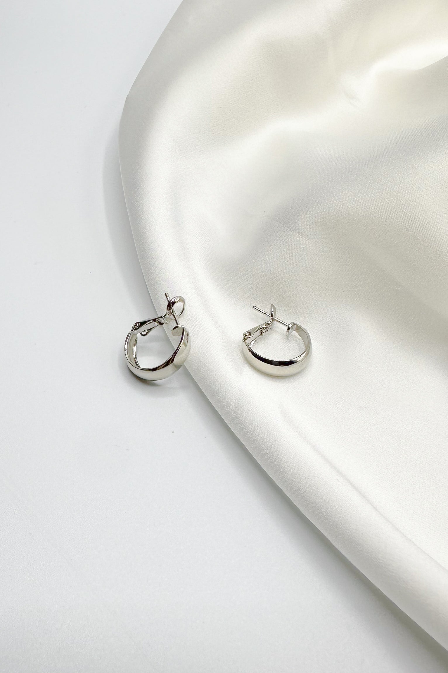 Tessa Silver Mini Huggies Earring- close up front view