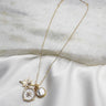 Luna Gold & Pearl Starburst Medallion Necklace- close up front view