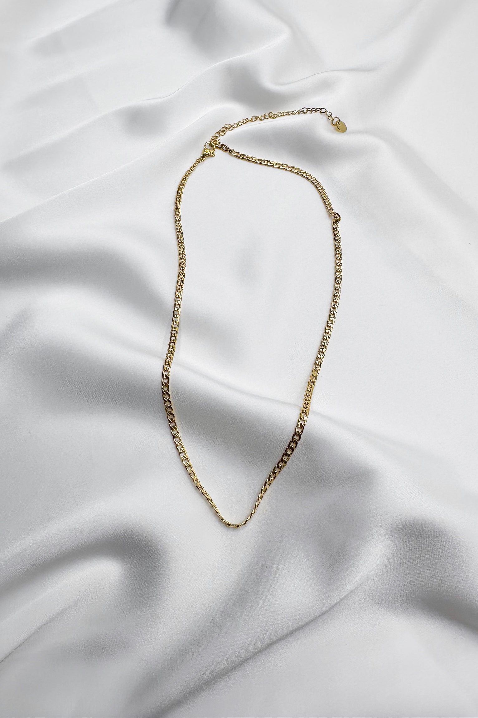 Aria Gold Chain Link Necklace- close up flat lay view