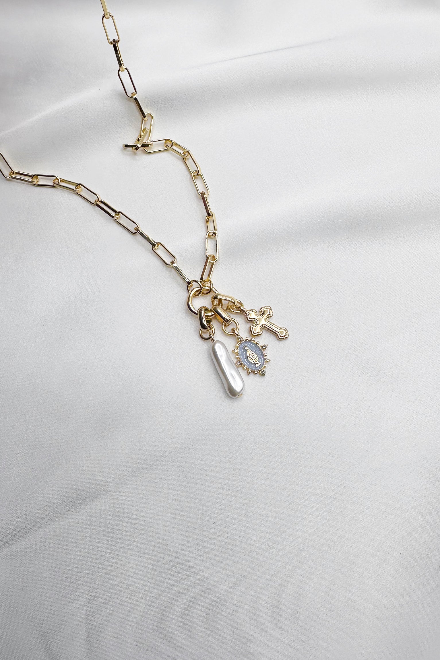 Celeste Gold Pearl & Cross Medallion Necklace- close up front view