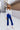 Full body front view of model wearing the On The Horizon Velvet Pants, which feature cobalt blue velvet, front ankle slits, and a high-rise elastic waist.