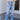 Front view of model wearing the Ceros: Charlotte Dad Jeans, which feature medium-wash-denim with light distressing, a straight let fit, and front and back pockets
