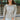 Front view of model wearing the Forever Yours Top, which has a sage green fabric , a round neckline, long sleeves, a back tie closure at the neck, and a flowy fit