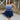 Frontal view of the Light of Your Life Mini Dress that features a tulle material, a monochromatic tiered design, a straight neckline, a sleeveless design with thin adjustable straps, a back zipper closure, and a mini length.