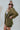 Side view of the Livin' The Dream Blazer that features an olive green colored material, a collar and lapel, an open front, a 3/4 cuffed sleeve, and two front pockets.
