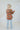 Back view of the Can't Stop Me Flannel Jacket that features a rust colored flannel material, a multi-colored plaid pattern, a brown thermal material hood with adjustable strings, a button-up front, long cuffed sleeves, a brown thermal material siding, a f
