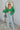 Full body front view of the She's So Lucky Cropped Cardigan, that features a green knit material, a V neckline, a two button-up front, long sleeves, and a cropped fit
