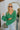 Front view of the She's So Lucky Cropped Cardigan, that features a green knit material, a V neckline, a two button-up front, long sleeves, and a cropped fit