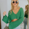 Front view of the She's So Lucky Cropped Cardigan, that features a green knit material, a V neckline, a two button-up front, long sleeves, and a cropped fit