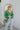 front view of the She's So Lucky Cropped Cardigan, that features a green knit material, a V neckline, a two button-up front, long sleeves, and a cropped fit