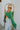 Side view of the She's So Lucky Cropped Cardigan, that features a green knit material, a V neckline, a two button-up front, long sleeves, and a cropped fit