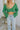 Close-up front view of the She's So Lucky Cropped Cardigan, that features a green knit material, a V neckline, a two button-up front, long sleeves, and a cropped fit