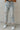 Frontal view of the Signature 8: Next Move Straight Leg Jeans that features a medium wash denim, a high-rise fit, a button and zipper closure, two front pockets, distressing at the knee, a raw distressed hem, two back pockets, and a straight leg fit.