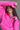 Close front view of model wearing the Hot Pink Quarter-Zip Sweatshirt that has hot pink knit fabric with a soft fleece interior, long raglan sleeves, a quarter-zip front with a high neck, and a kangaroo pocket.