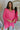 Front view of model wearing the Take My Hand Sweater that has hot pink loose-knit fabric, a high-low hem, a round neck, and 3/4 batwing sleeves with cuffs