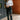 Full body view of model wearing the Piper White Knit Long Sleeve Bodysuit which features white knit fabric, high neckline, long sleeves and thong bottom with button snap closures.
