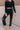 Front view of model wearing the Judy Blue: Alicia Black Straight Leg Jeans which features washed black denim, two front pockets, two back pockets, front zipper with button closure, belt loops, distressed details, busted knee details and straight pant legs